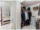 Walk-in closet showing ample hanging and shelf storage, with bedroom viewable in background at 402 Bainbridge Dr, Atlanta, GA 30327