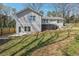 Fenced backyard featuring lush lawn and a spacious deck perfect for outdoor entertaining at 596 Frank Kirk Nw Rd, Kennesaw, GA 30152