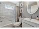 Bathroom with a tiled shower, vanity sink, and framed art prints at 596 Frank Kirk Nw Rd, Kennesaw, GA 30152
