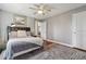 Bedroom featuring a plush rug, stylish décor, and ample natural light at 596 Frank Kirk Nw Rd, Kennesaw, GA 30152