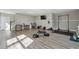Large flex space with LVP flooring and home gym featuring plenty of natural light at 596 Frank Kirk Nw Rd, Kennesaw, GA 30152