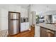 Modern kitchen with stainless steel appliances, granite countertops, and sleek cabinetry for a clean design at 596 Frank Kirk Nw Rd, Kennesaw, GA 30152