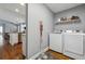 Conveniently located laundry room just off the kitchen with stainless steel appliances at 596 Frank Kirk Nw Rd, Kennesaw, GA 30152