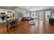 Open concept living area with hardwood floors, vaulted ceilings, and access to the backyard at 596 Frank Kirk Nw Rd, Kennesaw, GA 30152