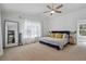 Bright main bedroom with vaulted ceiling, large windows, and plush carpeting at 596 Frank Kirk Nw Rd, Kennesaw, GA 30152