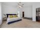 Spacious main bedroom with a walk-in closet and seating area at 596 Frank Kirk Nw Rd, Kennesaw, GA 30152