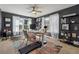 Home office with treadmill, lots of natural light, and lots of decorations at 596 Frank Kirk Nw Rd, Kennesaw, GA 30152