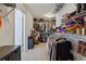 Large walk-in closet with clothing racks and shelves for organized storage at 596 Frank Kirk Nw Rd, Kennesaw, GA 30152