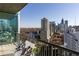 City view from a high-rise balcony featuring comfortable seating and skyline views at 1080 Peachtree Ne St # 2011, Atlanta, GA 30309