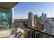 Enjoy city views from this balcony, complete with chairs and a table for relaxing and taking in the scenery at 1080 Peachtree Ne St # 2011, Atlanta, GA 30309