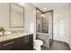 Bathroom featuring a dark vanity with granite countertops and glass enclosed shower at 1080 Peachtree Ne St # 2011, Atlanta, GA 30309