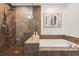 Walk-in shower paired with soaking tub, complemented by neutral tile work in bathroom at 1080 Peachtree Ne St # 2011, Atlanta, GA 30309