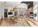 Bright and open dining area featuring contemporary lighting and a long wooden table at 1080 Peachtree Ne St # 2011, Atlanta, GA 30309