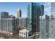 Stunning condo exterior showing glass high rise building with beautiful cityscape view on a bright sunny day at 1080 Peachtree Ne St # 2011, Atlanta, GA 30309