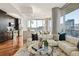 Open-concept living space with gourmet kitchen, plush seating, and natural light at 1080 Peachtree Ne St # 2011, Atlanta, GA 30309