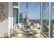 Bright living room with floor-to-ceiling windows offering stunning city views and stylish decor at 1080 Peachtree Ne St # 2011, Atlanta, GA 30309