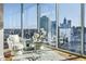 Bright living room featuring floor-to-ceiling windows with stunning city views at 1080 Peachtree Ne St # 2011, Atlanta, GA 30309