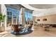 Bright and airy lounge area featuring contemporary furniture, floor to ceiling windows, and city views at 1080 Peachtree Ne St # 2011, Atlanta, GA 30309