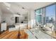 Serene main bedroom features city views and a stylish sitting area at 1080 Peachtree Ne St # 2011, Atlanta, GA 30309
