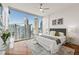 Bedroom featuring hardwood floors, cityscape views, and bright natural light at 1080 Peachtree Ne St # 2011, Atlanta, GA 30309