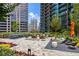 Serene outdoor patio with lounge seating, fire pit and views of the surrounding buildings at 1080 Peachtree Ne St # 2011, Atlanta, GA 30309