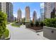 Outdoor terrace with manicured landscaping and city skyline views at 1080 Peachtree Ne St # 2011, Atlanta, GA 30309