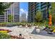 Chic outdoor area with comfortable seating and dining spaces, surrounded by beautifully landscaped gardens at 1080 Peachtree Ne St # 2011, Atlanta, GA 30309