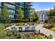 Lush outdoor seating area with dining tables and inviting lounge spaces, ideal for social gatherings at 1080 Peachtree Ne St # 2011, Atlanta, GA 30309