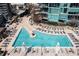 Aerial view of a large rectangular pool surrounded by lounge chairs and umbrellas at 1080 Peachtree Ne St # 2011, Atlanta, GA 30309