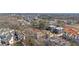 High-angle view of a neighborhood featuring townhomes, apartments, and wooded areas near a busy highway at 115 Alcovy Ter, Alpharetta, GA 30009