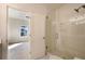 Bathroom featuring a glass-enclosed shower with white subway tile and an adjacent bedroom at 115 Alcovy Ter, Alpharetta, GA 30009