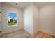 Bright bedroom with beautiful wood floors and a window overlooking a well manicured lawn at 115 Alcovy Ter, Alpharetta, GA 30009