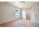 Bedroom featuring natural light, hardwood floors, and a sliding barn door to the closet at 115 Alcovy Ter, Alpharetta, GA 30009