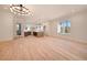 Bright and airy living room showcasing hardwood floors, recessed lighting, and seamless flow to the kitchen at 115 Alcovy Ter, Alpharetta, GA 30009