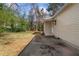 Exterior view of backyard and side yard including a detached home with vinyl siding at 1179 Aleamo Dr, Marietta, GA 30062