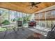 Relaxing screened-in porch with wooded ceiling, ample seating, providing a comfortable outdoor living space at 4203 Deerbrook Sw Way, Lilburn, GA 30047