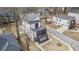 Aerial view of modern home with multi-level decks in a suburban neighborhood at 662 S Grand Nw Ave, Atlanta, GA 30318