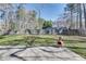 Spacious backyard with a wooden fence, chimenea, and a lush green lawn, perfect for outdoor enjoyment at , Kennesaw, GA 30152