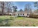 Wide backyard view showcasing a well-maintained lawn, a shed, a patio, and the home's exterior at , Kennesaw, GA 30152