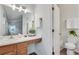 Modern bathroom features a vanity, a bright mirror, and a view to an adjacent shower and toilet at , Kennesaw, GA 30152