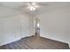 Bedroom with white trim, modern vinyl flooring, and door leading to other rooms at , Kennesaw, GA 30152