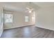 Bedroom with vaulted ceiling, three windows, and modern vinyl flooring at , Kennesaw, GA 30152