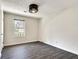 Well-lit bedroom with large window, neutral paint, modern vinyl flooring at , Kennesaw, GA 30152