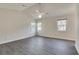 Bright bedroom featuring modern vinyl flooring, vaulted ceilings, and three large windows at , Kennesaw, GA 30152