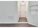 Bright entryway featuring stylish flooring, a pristine white door, and modern wall decor at , Kennesaw, GA 30152