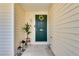 Welcoming front door adorned with a wreath, complemented by stylish lanterns and a potted plant at , Kennesaw, GA 30152