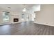 Bright living room showcasing stylish flooring, a stone fireplace, and windows offering natural light at , Kennesaw, GA 30152