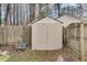 Practical backyard shed providing additional storage space, surrounded by greenery and a wooden fence at , Kennesaw, GA 30152