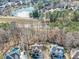 An aerial view showcases a waterfront property, highlighting its scenic backyard view of the lake at 1654 Summersweet Ln, Dacula, GA 30019