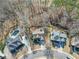 Aerial view of a property showcasing the home, pool, surrounding landscape, and neighborhood at 1654 Summersweet Ln, Dacula, GA 30019